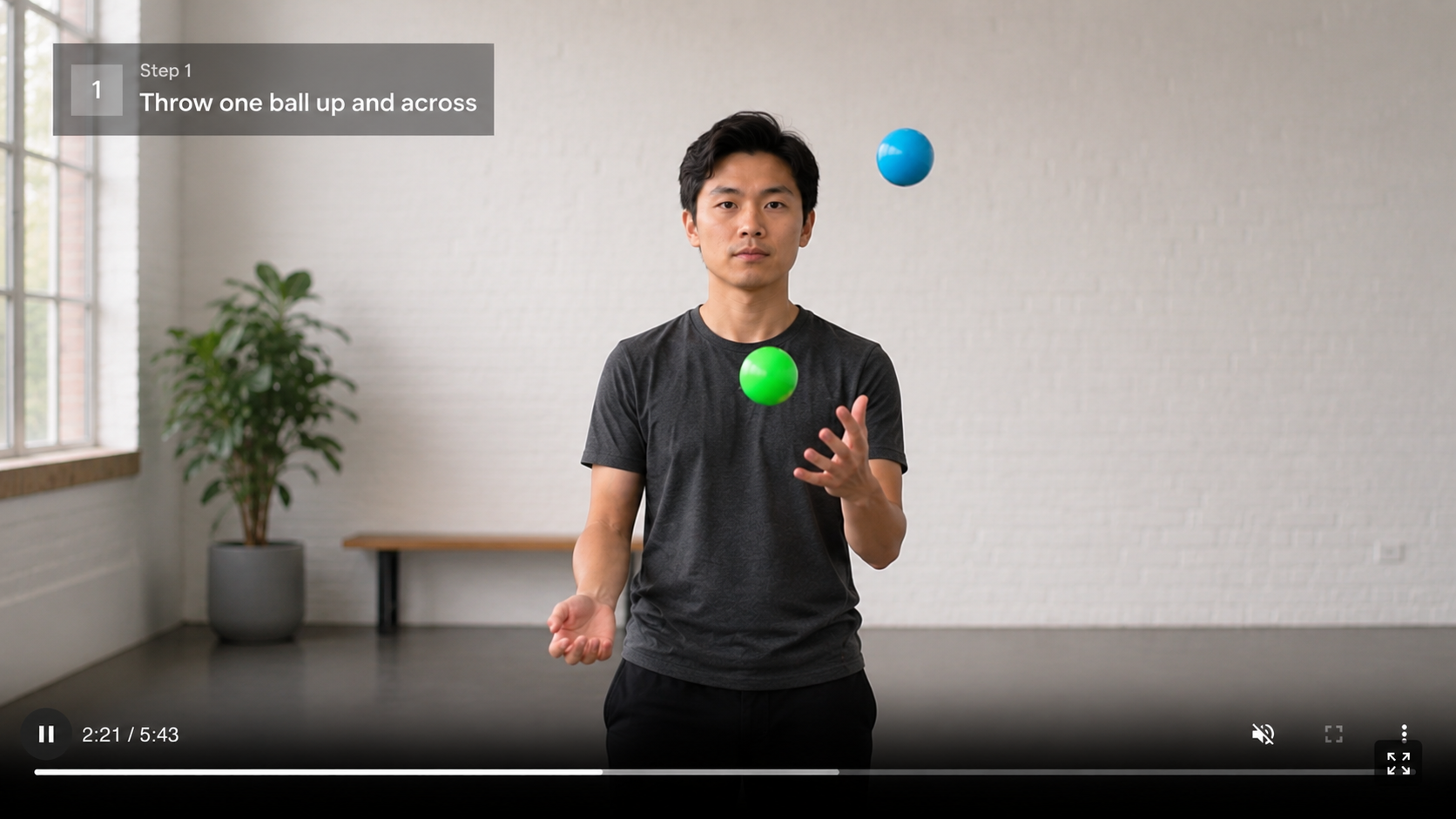 Video player showing a juggling tutorial with a step text overlay on screen